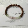 Pulsera Nueva de Estilo Chino Retro con Veta de Madera de Ala de Pollo Ensamblada, Estilo Minimalista Simple y de Moda con Perlas de Ojo de Gato Transparentes como el Hielo