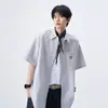 Camisa de Manga Curta com Listras Bordadas de Sorriso para Homens e Mulheres 2026 Verão Nova Marca Tendência Solta Casual Simples Camisa de Casal