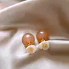 Pendientes de bola de flor estilo nuevo 2025 para mujer diseño nicho pendientes de lujo de alta gama exquisitos