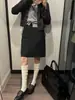 Falda de verano nueva estilo coreano para mujer talla grande para mujeres ligeramente rellenitas, falda midi bodycon de línea A de cintura alta negra con lunares