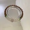 Pulsera Nueva de Estilo Chino Retro con Veta de Madera de Ala de Pollo Ensamblada, Estilo Minimalista Simple y de Moda con Perlas de Ojo de Gato Transparentes como el Hielo