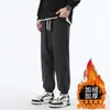 Calças de moletom de veludo cotelê para outono e inverno, calças casuais com retalhos, calças jogger masculinas de corte solto com forro de fleece e design espessado