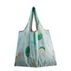 Bolsa de almacenamiento portátil para supermercado de exportación en stock mediana bolsa de compras bolsa de protección ambiental bolso de mano bolsa de compras plegable nailon