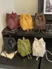 Bolso de hombro de moda nuevo para otoño 2026 transfronterizo, bolso tipo cubo tejido con cordón versátil, bolso cruzado elegante y moderno