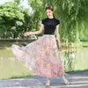 26 Nova Saia Estampada Estilo Boho Resort Europeu e Americano Primavera/Verão com Barra Larga para Mulheres