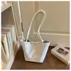 Bolso de mano de nicho estilo coreano, bolso tote pequeño para mujer, bolso cubo de nailon de gran capacidad, bolso de hombro tipo cesta simple
