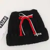Gorro de punto de mezcla de lana de alta calidad con un lazo y orejas de gato, diseñado para mujeres, perfecto para otoño e invierno, proporcionando calidez y protección para los oídos, y haciendo que el rostro parezca más pequeño