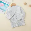 26 Camiseta Térmica de Manga Longa Base para Crianças Outono/Inverno Nova Colorida de Algodão Manga Longa Cor Sólida Listrada Camisa de Outono para Meninos e Meninas