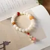 Pulsera de Raíz de Bodhi de Jade Blanco Hilo Estilo Chino Estilo Bosque Fresco Cuentas de Oración Pulsera de Muñeca Flor de Loto Borla Fuente Mayorista