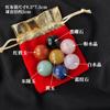 Bola de cristal natural de siete colores juego de bolsa de tela roja adornos curativos Chakela europeos y americanos juego estándar de minerales de bola de cristal