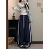 Foto real de los nuevos pantalones casuales holgados de diseño coreano para mujer de otoño 2026 con cordón en la cintura elástica y puños en los tobillos
