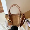 Bolso de gamuza para mujer, nuevo y moderno estilo retro de otoño 2026, adecuado para ir al trabajo, bolso de hombro, bolso cruzado, bolso tipo cubo