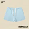 Conjunto de ropa europea y americana para mujer transfronterizo: sudadera casual y shorts, sudadera holgada de forro polar color liso, cuello medio alto, estilo 'dopamine hot girl'