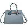 Bolso de mano transfronterizo de lujo ligero, bolso cruzado para mujer, modelo nuevo con cierre, bolso de hombro versátil, patrón de lichi, bolso de alta gama para el día a día