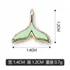 El material KC dorado y blanco de cola de pez K se puede mezclar en lotes para colgantes transfronterizos, dijes, pulseras, collares y accesorios de joyería.. Ventas directas del fabricante para bricolaje