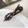 Elegante presilha de cabelo com laço de couro, novo prendedor torcido de estampa de leopardo de alta qualidade para mulheres, adequado para estilizar o cabelo na parte de trás da cabeça