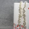 Pendientes largos con letras coreanas de alta gama, superllamativas, con diseño de nicho de diamantes de imitación en inglés, con borlas para mujer.