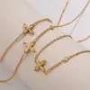 Europa y Estados Unidos collar cruzado nuevo transfronterizo acero inoxidable chapado en oro de 18 quilates incrustado con cristal joyería versátil mujeres