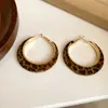 Pendientes de borla con carcasa de madera marrón transfronterizos europeos y americanos, pendientes de estilo vintage Maillard, pendientes de mujer de lujo ligero de alta gama