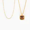 Colgante de piedra de ojo de tigre con incrustaciones cuadradas, estilo transfronterizo francés, con nicho simple, chapado en acero de titanio y oro de 18 quilates, venta al por mayor