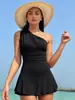 Bikini de una pieza estilo europeo y americano 2026, Shorts ajustados de una sola manga con borde de falda con volantes para mujer
