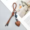 Nova Série Miu Moda Corda de Couro Trançada à Mão Pingente de Coração de Cristal Bolsa Pendente Carro Pingente Chaveiro Atacado