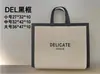Bolsa no tejida de color spot recubierta con prensado en caliente bolsa de regalo publicitaria bolsa de compras de ropa no tejida portátil impresión de logotipo