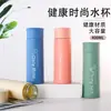 Venta al por mayor Taza de doble pared para estudiantes de 400 ml portátil con tapa de botón regalo asa de vidrio Taza imprimible