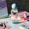 Taza de vidrio de borosilicato alto resistente a altas temperaturas taza láser para niñas alto valor de color taza pequeña portátil para sorber taza de agua fresca de verano