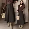 Falda de lana de línea A de longitud media para otoño e invierno, de cintura alta, acampanada, cubre las caderas, estiliza, versátil, falda larga de lana