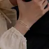 Pulsera de Hueso de Serpiente con Perlas Plateadas de Doble Capa, Cadena de Perlas de Arroz de Lujo Ligero Nicho, Nueva Cadena Lisa Estilo Minimalista 2026 Joyería al por Mayor