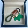 Dinero en el Caballo Cuero de Vaca Creativo Exquisito Casual Regalo de Pareja Bolso Lindo Colgante Llavero de Coche Llavero