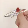 Transmisión en vivo de TikTok cobre blanco plateado estilo joven diseño de nicho ins artículo popular de celebridad de internet pulsera de figura de ocho de empuje y extracción para mujeres