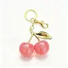 Piedras colgantes de cristal con forma de cereza de moda más vendidas, dijes de resina y accesorios - venta al por mayor para Shein, Temu y Amazon