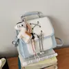 Mochila de nicho transfronteriza para mujer 2026 primavera/verano nuevo color de moda bloques de color mochila para el día a día bolso de un solo hombro cruzado de alto valor
