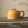 Sección dorada barro morado tetera arcilla hecha a mano relieve mineral crudo kung fu juego de té de alta calidad dragón y fénix taza de té tetera venta al por mayor
