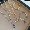 Conjunto de Colar e Pulseira com Pingente de Triângulo Irregular de Strass Transfronteiriço Europeu e Americano Moda Estilo Ins Joias com Sensação de Alto Padrão