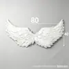 Fabricantes transfronterizos suministran alas de plumas de ángel, alas de plumas para disfraces de adultos, accesorios para la espalda y utilería para actuaciones infantiles.