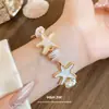 Pulsera de Estrella de Tablero de Perlas Transfronteriza Europea y Americana Estilo de Moda para Vacaciones Pulsera de Lujo Ligero Sensación de Alta Gama Joyería de Mano Venta al por Mayor