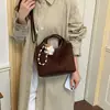 Bolsa bucket da moda para mulheres, nova coleção 2026, estilo retrô, adequada para o uso diário, design simples, ideal para o trajeto diário, e pode ser usada como bolsa de ombro ou bolsa transversal