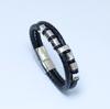 Europa y Estados Unidos pulsera de joyería de venta caliente de acero de titanio tejido de cuero pulsera de cuero de personalidad para hombre de acero inoxidable fabricantes mayoristas T127