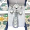 Conjunto de tres piezas de calcedonia con incrustaciones plateadas de fábrica, pendientes con forma de huevo de calcedonia simple y fresca, colgante de Buda