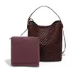 Bolsa Nueva de Mujer Transfronteriza Primavera 2025 Piel Suave Completamente Tejida a Mano Gran Capacidad Bolso Cubo Vintage Bolso Cruzado