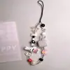 Cordón para Funda de Teléfono de Cerámica con Cuentas Estilo Cartoon Ins con un Toque de Alta Gama y Encanto de Cámara Ccd Lindo