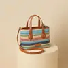 Bolsas 2026 Nuevas Bolsas de Otoño e Invierno para Mujer Bolsa Tejida Arcoíris Bolso de Mano Versátil Estilo de Alta Gama Bolso Pequeño de Hombro Cruzado