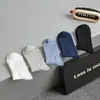 Meias masculinas outono e inverno novas cor sólida cintura alta meias masculinas até a panturrilha meias de algodão respiráveis preto e branco clássico Esportes meias masculinas atacado
