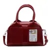 Moda Nova Primavera 2025 Rosto Brilhante Cor Sólida Coreana Bolsa Boston Portátil Design de Nicho Bolsa de Ombro Transversal