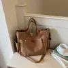 Bolso de lona de gran capacidad transfronterizo para mujer, nuevo modelo 2026, adecuado para estudiantes universitarios, para ir al trabajo, bolso de mano, bolso de hombro, bolso cruzado