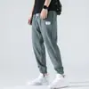Calça Casual Masculina de Seda Gelada Nove Pontos Calças Masculinas Verão Fina Estilo Hong Kong Tendência Esportiva Perna Larga Respirável Calças de Verão