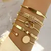 Moda europea y americana nueva personalidad moda repujado giro geométrico multicapa pulsera apilada juego de 10 piezas de decoraciones al por mayor